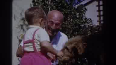 Glendale California (1962): Grandfather Plays With His Grandson And His Dog In The