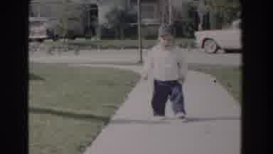 Glendale California (1962): Young Boy Walking On The Sidewalk And Smiling While