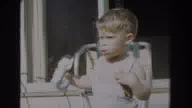 Glendale California (1962): One Little Kid Is Walking Outside With His Toy In The