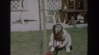 Glendale California (1962): A Little Boy Is Walking And Playing With A Toy Outside