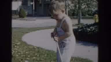 Glendale California (1962): Child Plays And Has Fun With His Saltpeter And His Toy