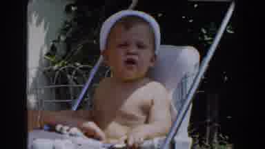 Glendale California (1962): A Woman Playing With A Baby Sitting In The Cradle