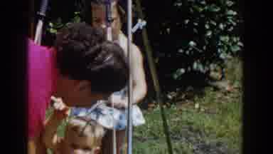 Glendale California (1962): Baby Is Placed On A Stroller And His Sister Rocks Him