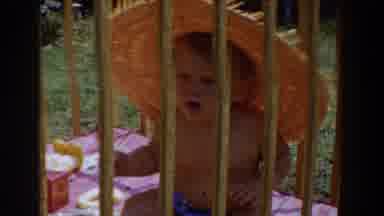 Glendale California (1962): A Blond Baby In A Crib Outside Wears A Shaw Sunhat And