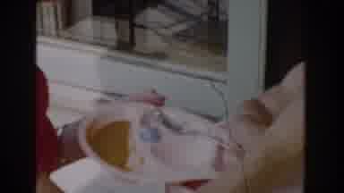 Glendale California (1962): Toddler Sitting In White Highchair Looks At Small
