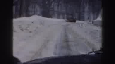 New Hampshire (1962): Vehicle Moves Down Snow Covered Winding Road Snow On Ground