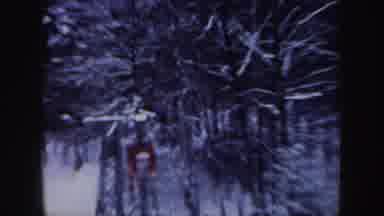 New Hampshire (1962): Lonely Red Cable Car Going Through Snowy Trees During Winter