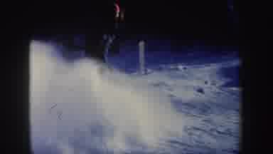 New Hampshire (1962): Person Skiing Downhill In The Woods And Making A Sudden Stop