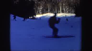 New Hampshire (1962): Multiple People Skiing Down Gradual Snow Slope In Winter