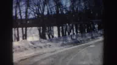 New Hampshire (1962): One Of A Gathering Of Cars Driving Down A Scenic Snowy Road