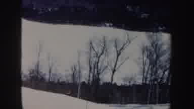 New Hampshire (1962): A Man Is Jet skiing On An Icy Land Surrounded By Thick Short