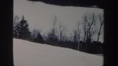 New Hampshire (1962): A Woman In A White Coat King Down A Snow Hill