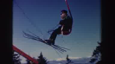 New Hampshire (1962): Two People On A Ski Lift Landing On A Platform With Skiers