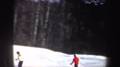 New Hampshire (1962): Man In Red Coat Having Fun Skiing In The Mountains With Snow