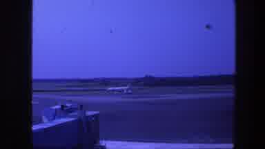 Copenhagen Denmark (1975): An Planner Speed Slowly On The Runway In An Airport