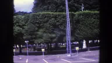 Copenhagen Denmark (1975): View Of Four Cars Parked Near Green Trees On A Bright