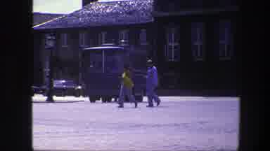 Copenhagen Denmark (1975): People Walking On A Cobblestone Street With Traffic On