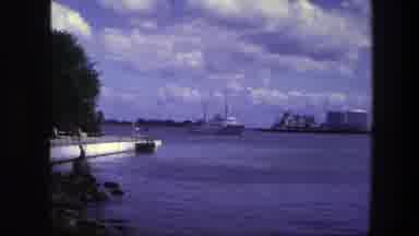 Copenhagen Denmark (1975): On A Cloudy Day A Boat Is Seen Sailing Across A River