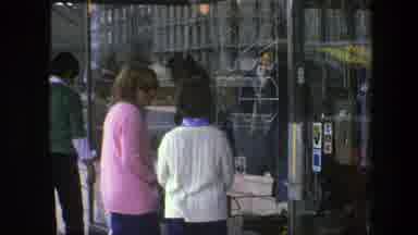 Copenhagen Denmark (1975): Two People Look At Items Through Glass Store Display