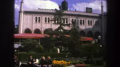 Copenhagen Denmark (1975): People Relaxing Ne To A Garden And An Ancient Building