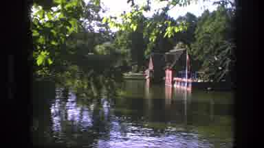 Copenhagen Denmark (1975): View Of Red Flag Flying Over Calm Water Near Green