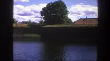 Copenhagen Denmark (1975): A View Of A Orange Roof Near A River And A Big Wall Of