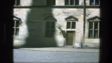 Copenhagen Denmark (1975): Person With Blue Top Walking In Front Of Large Gray