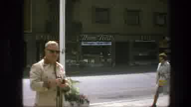 Copenhagen Denmark (1975): View Of People Walking Past Small Shops On A Sunny Day