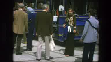 Copenhagen Denmark (1975): Woman Wearing Brown Pants Points To Person Wearing Gray