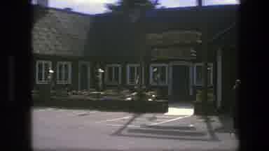 Copenhagen Denmark (1975): Three Cars Parked Near Brown And White Building On A
