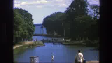 Copenhagen Denmark (1975): Lady Walking By Water Perhaps Meeting Someone Getting