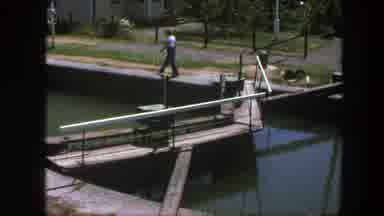 Copenhagen Denmark (1975): Man Strolls Footpath Alongside Open Canal Surrounded By