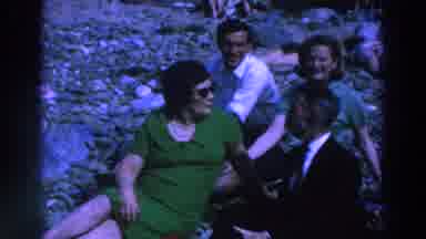 Ireland (1961): Five People Sitting On Gray Rocks Talking On A Clear Day
