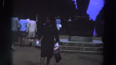 Ireland (1961): A Woman Walking Backwards And Looking For The People Around Her