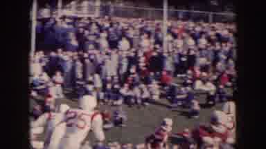 Nebraska (1957): Large Crowd Watches Football Game play On A Bright Sunny Day