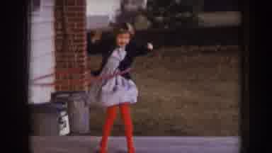 Nebraska (1957): Girl Wearing Red Dress Plays With Red Hula Hoop