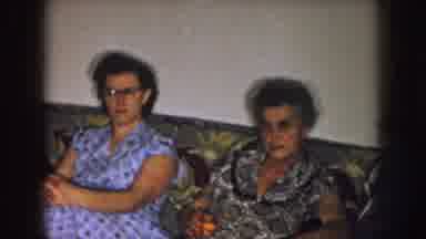 Nebraska (1957): Two Women And Two Men Sitting On A Couch And Chair In A Living