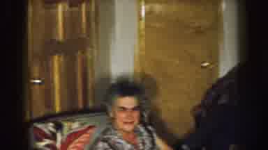 Nebraska (1957): Three Men Sitting Near Brown Door Looking At Off Screen Object