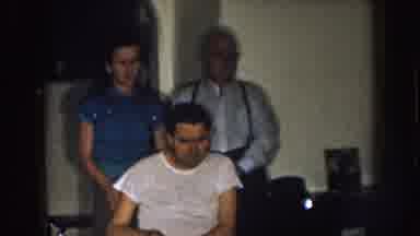 Nebraska (1957): Man In A Wheelchair With A Woman And Man Standing Behind Him
