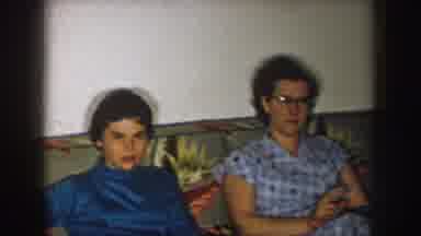 Nebraska (1957): Old Video With Mom And Daughter Sitting On A Sofa Wearing A Dark