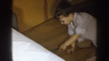 Nebraska (1957): A Little Boy Plays With A Paint Brush On Hardwood Floors