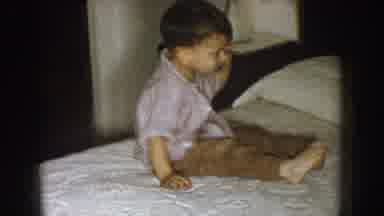 Nebraska (1957): A Boy Nods His Head Playfully As He Watches His Dad Smoke