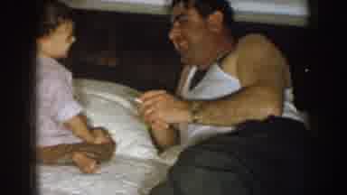 Nebraska (1957): A Guy Over His Bed With His Baby Playing With Him And Smoking A