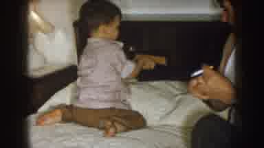 Nebraska (1957): Cute Son Opens A Calendar Book With His Dad By His Side