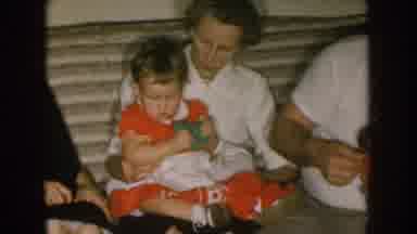 Nebraska (1957): A Kid Can Be Seen Playing With A Toy With His Family On Christmas
