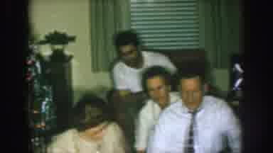 Nebraska (1957): A Group Of Well Dressed Men Berrying At The House
