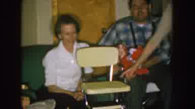 Nebraska (1957): Couple Waits Seated While Other Woman Plays Squeezing Nose And