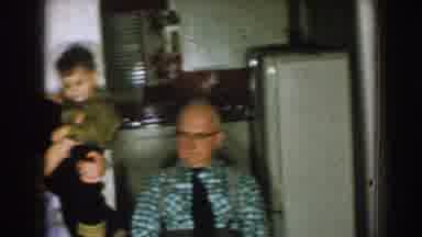 Nebraska (1957): Elderly Men Sit Around A Table While A Woman Holds A Small Boy