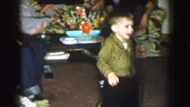 Nebraska (1957): Kid Playing At A Gathering Where Everyone Is Busy Talking With