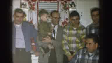Nebraska (1957): Man Wearing Glasses Talks To Three Men Standing Next To Window